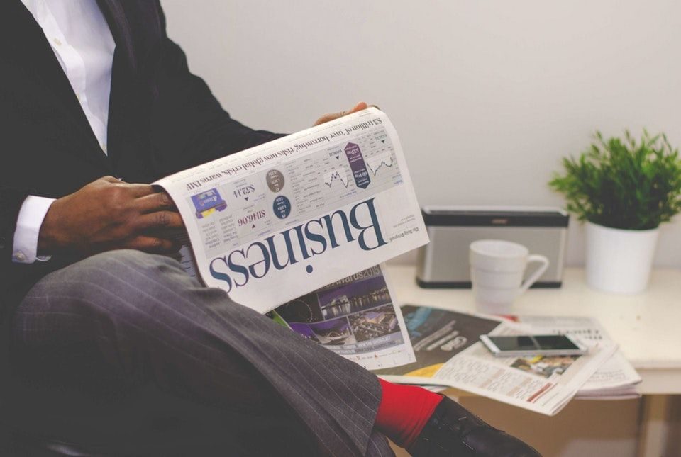 man reading newspaper